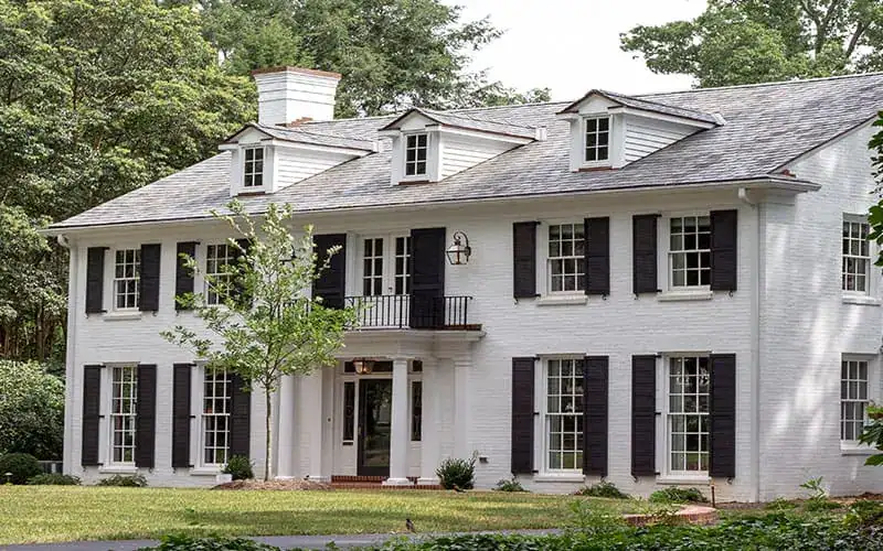 Two-story Carolina home with black shutters